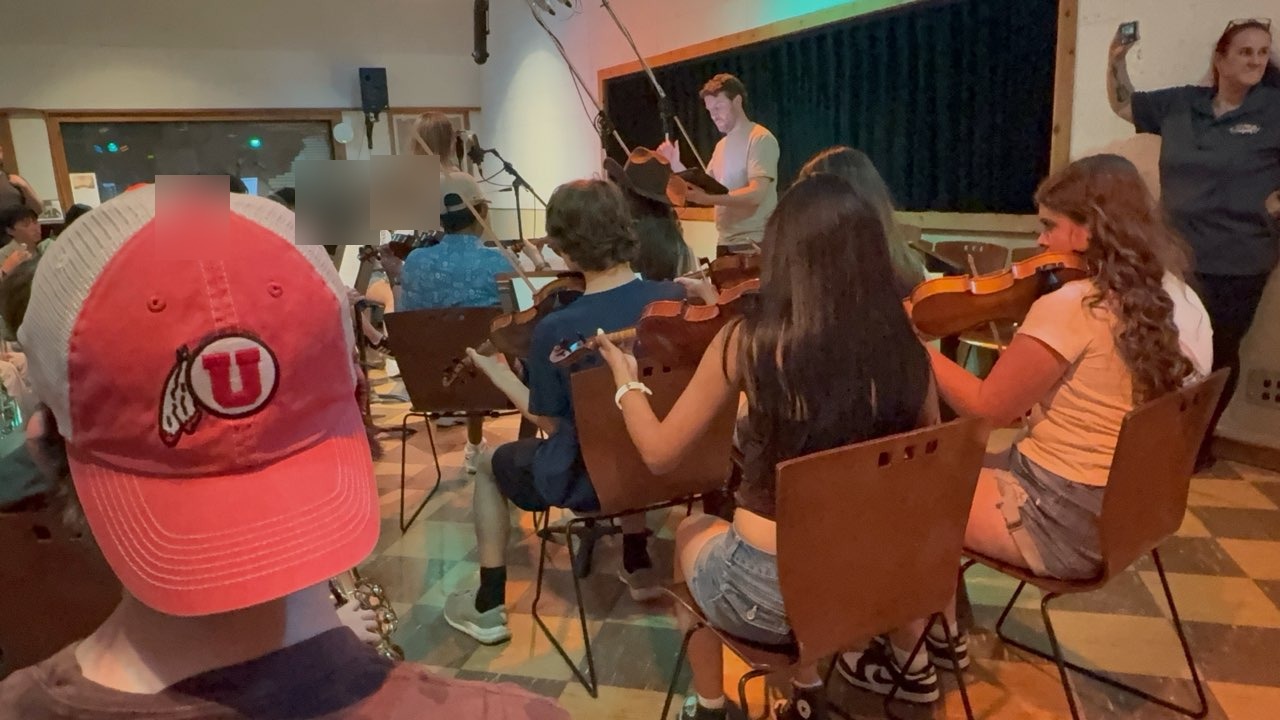 Rick Baumer teaching orchestra class